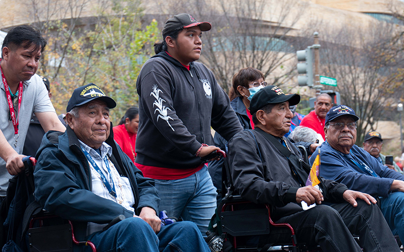 Michael Chiago Sr., a member of the Tohono O'odham Nation and Vietnam veteran, in center wheelchair at a march to dedicate the National Native American Veterans Memorial.